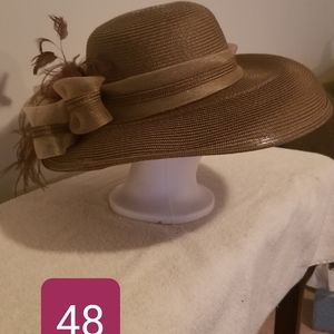 Tan/brown, wide-brimmed hat.